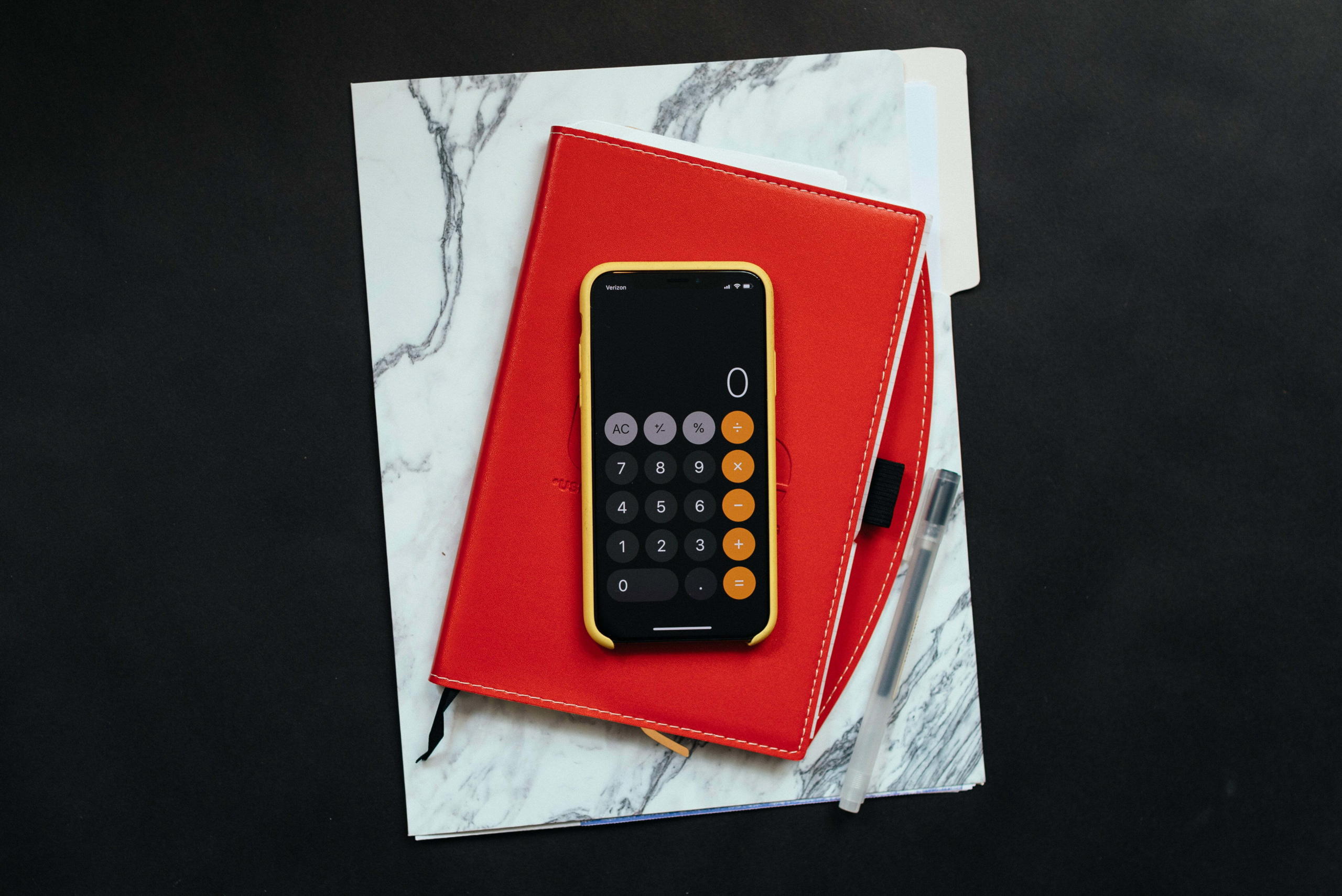 Photograph of a calculator and a notebook
