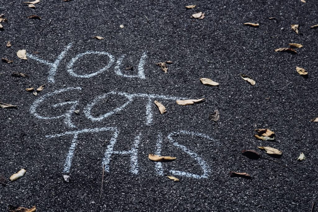 "YOU GOT THIS" written in large letters in chalk on the pavement
