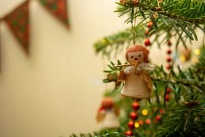 Photograph of an angel decoration hanging on a christmas tree