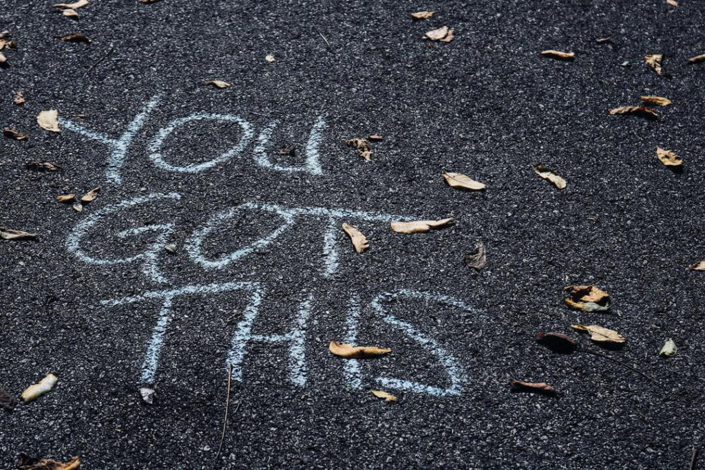 Photo of "YOU GOT THIS" written on the pavement in large chalk letters