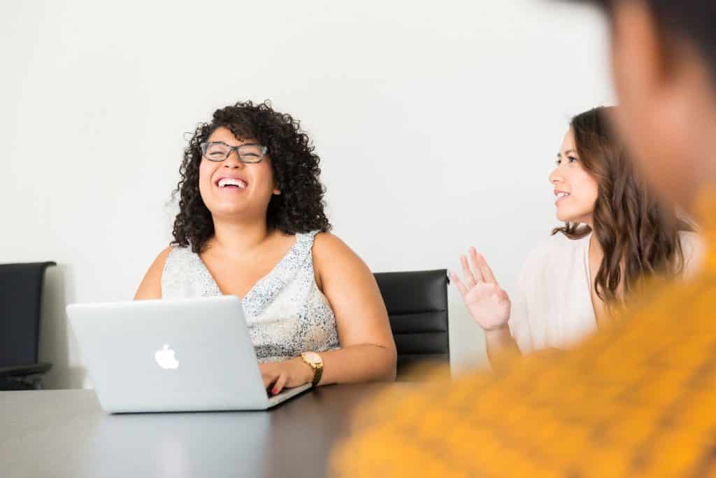 Team laughing together in their office