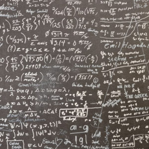 A blackboard filled with mathematical equations